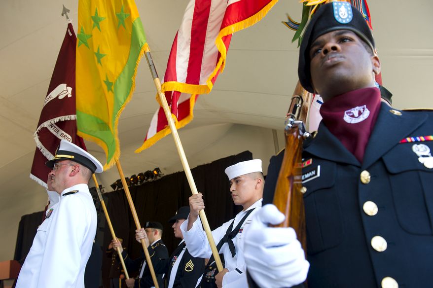 Military representatives of the Army and Navy bring in the Walter Reed colors during a ceremony Wedesday, July 27, 2011 at Walter Reed Army Medical Center in Washington, D.C. These old colors were retired, or "cased," during the ceremony, marking the transition from the Washington, D.C., facility to facilities at Ft. Belvoir and Bethesda Naval Medical Center. (Barbara L. Salisbury/The Washington Times)