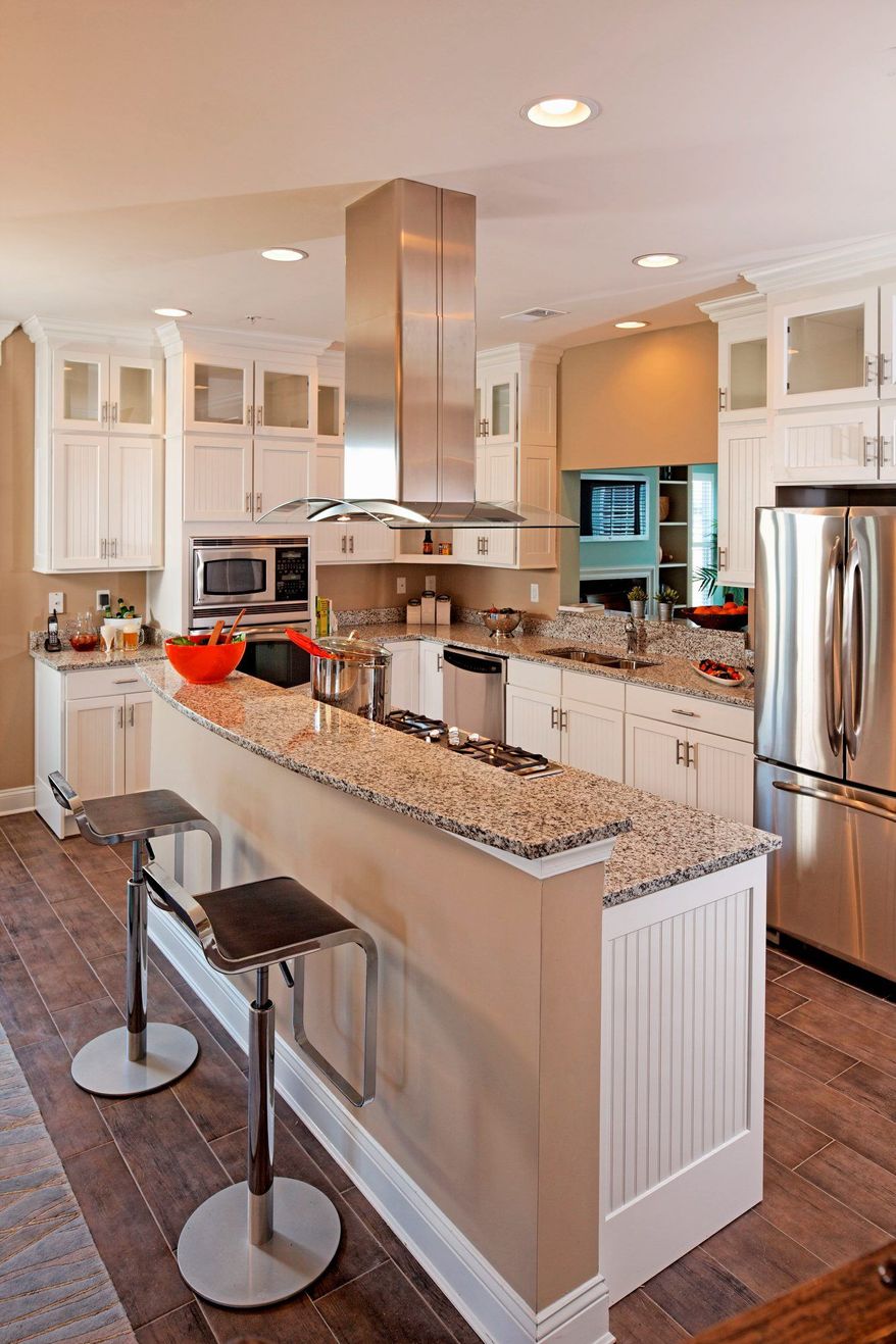 The kitchen in the Kent model has a 7-foot center island, 42-inch birch cabinets and a pass-through to the family room.