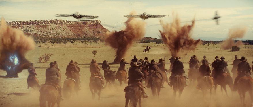 ASSOCIATED PRESS PHOTOGRAPHS
Townspeople in the Old West ride off to battle an enemy not from this world in "Cowboys & Aliens." The film stars Daniel Craig (below) and Harrison Ford.