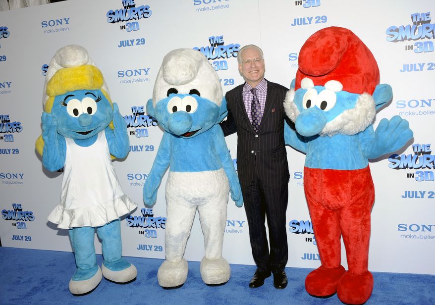 Televsion personality Tim Gunn poses with Smurf characters at the premiere of "The Smurfs" at the Ziegfeld Theatre in New York on July 24, 2011. (Associated Press)