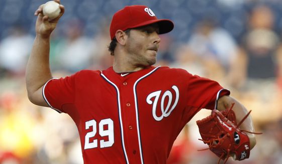 Starting in place of Jason Marquis, who was traded Saturday night, Yunesky Maya earned his first career win in the Washington Nationals&#x27; 3-0 victory over the New York Mets. (AP Photo/Luis M. Alvarez)