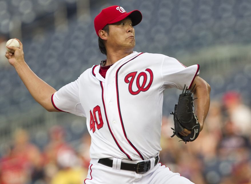Washington Nationals starting pitcher Chien-Ming Wang made his first start in more than two years, after undergoing surgery on his shoulder to repair a torn capsule, against the New York Mets on July 29, 2011. The Nats and Wang agreed to a new one-year contract Thursday, Nov. 3, 2011. (AP Photo/Evan Vucci)