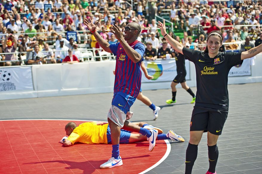 Los Angeles Lakers star Kobe Bryant and U.S. Soccer player Ali Krieger react to a near-miss Sunday during a charity soccer match played at Kastles Stadium in the District. Hosted by U.S. Soccer legend Mia Hamm, the event was held to raise awareness for bone-marrow donations.
PHOTOGRAPHS BY DREW ANGERER/THE WASHINGTON TIMES