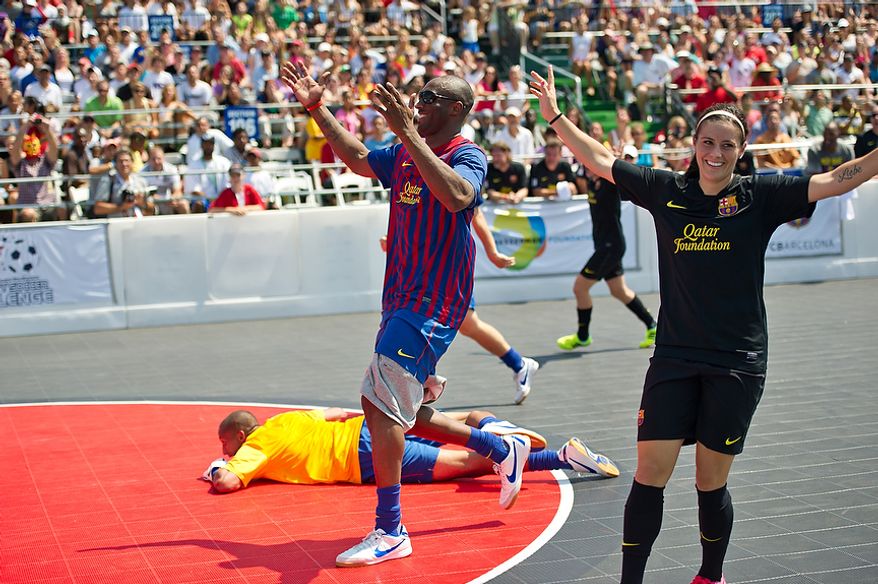 Kobe Bryant, center, and Ali Krieger, member of the U.S. Women's National team, react to a close shot on goal, during the Mia Hamm and Nomar Garciaparra Celebrity Soccer Challenge, at Washington Kastles Stadium, in Washington, D.C., Sunday, July 31, 2011. (Drew Angerer/The Washington Times)