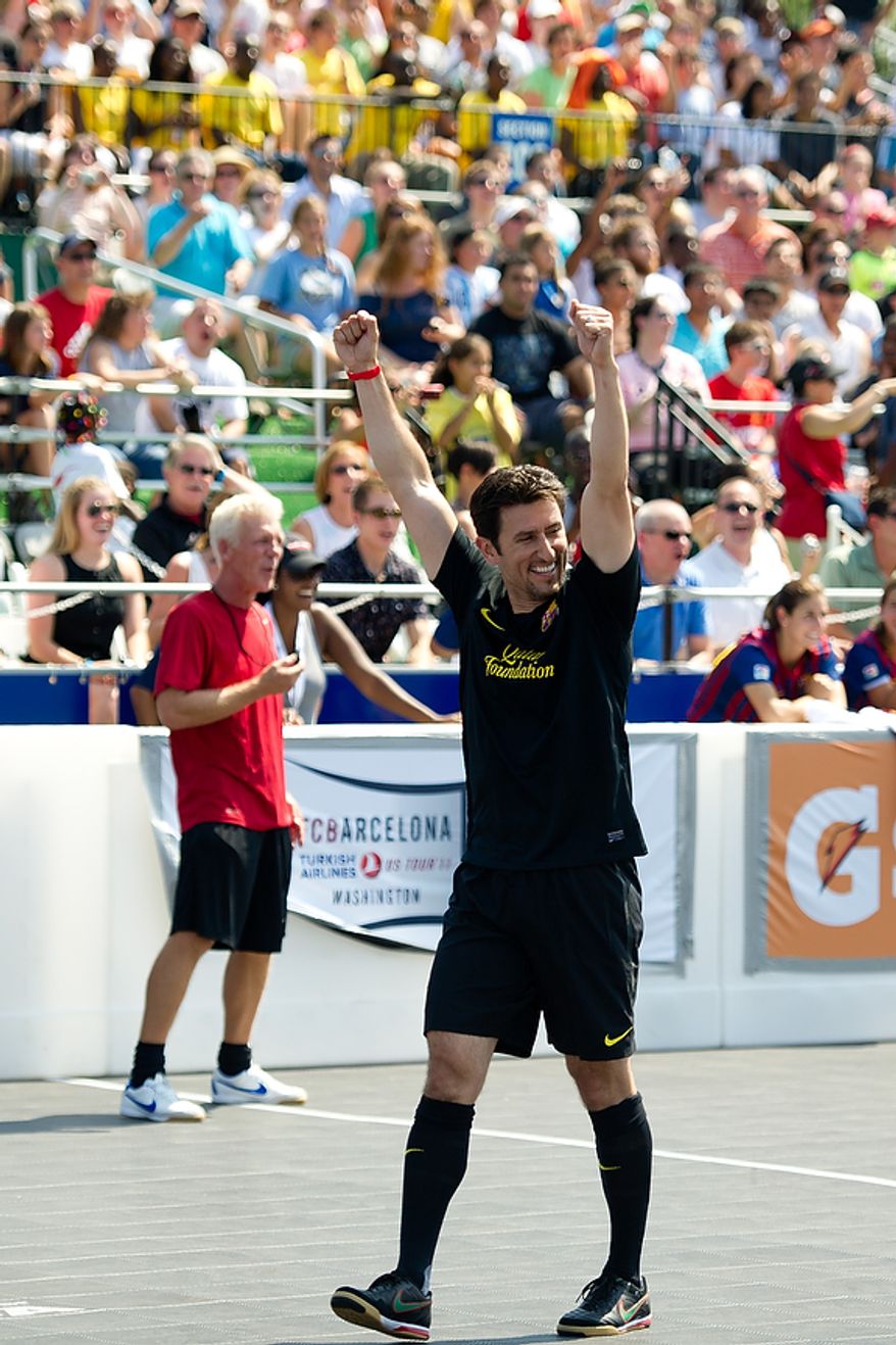 Nomar Garciaparra celebrates a goal for his team during the Mia Hamm and Nomar Garciaparra Celebrity Soccer Challenge, at Washington Kastles Stadium, in Washington, D.C., Sunday, July 31, 2011. (Drew Angerer/The Washington Times)