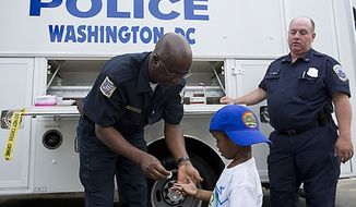 At the end of 2015, the Metropolitan Police Department employed fewer than 3,800 officers, well below the 4,200 officers that leaders have said were needed to police the District. (The Washington Times/File)