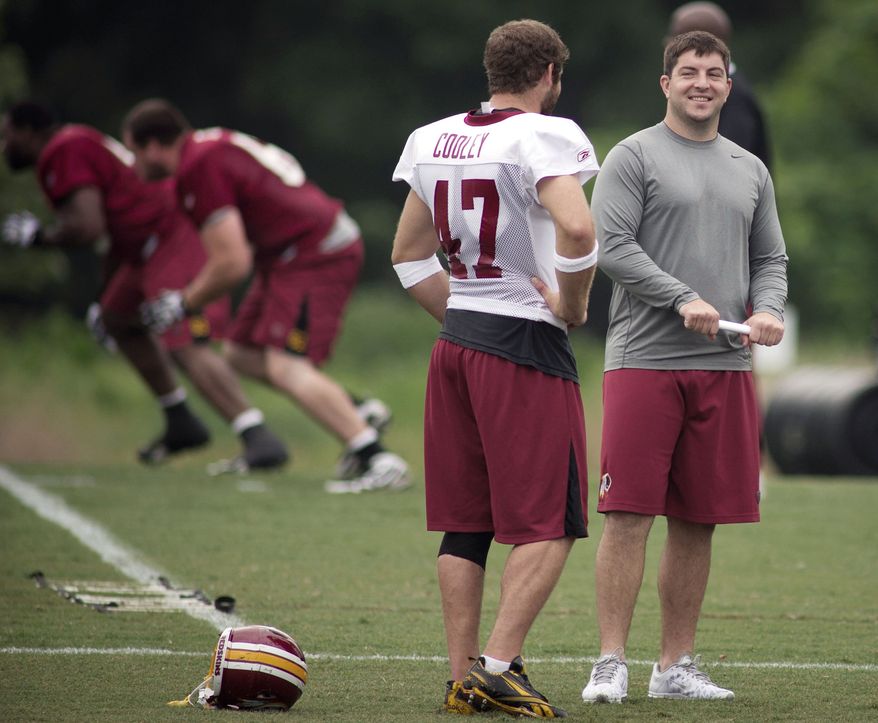 Redskins QB Rex Grossman (right) chats with tight end Chris Cooley during practice. (Rod Lamkey Jr./The Washington Times)