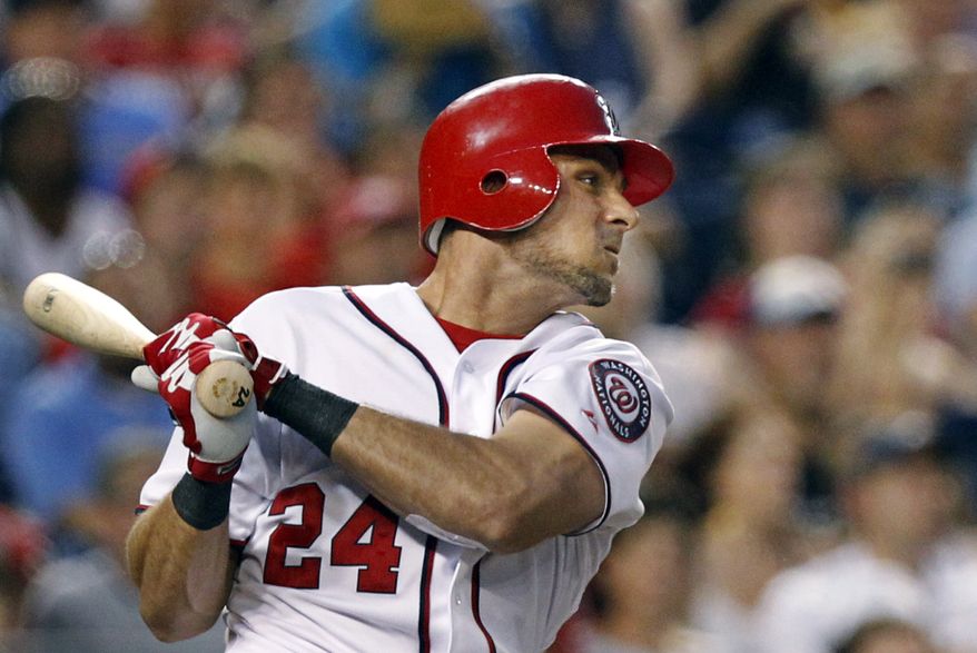 Washington Nationals center fielder Rick Ankiel follows through on his grand slam during the fourth inning against the Atlanta Braves on Tuesday. The Nationals won 9-3. (AP Photo/Manuel Balce Ceneta)