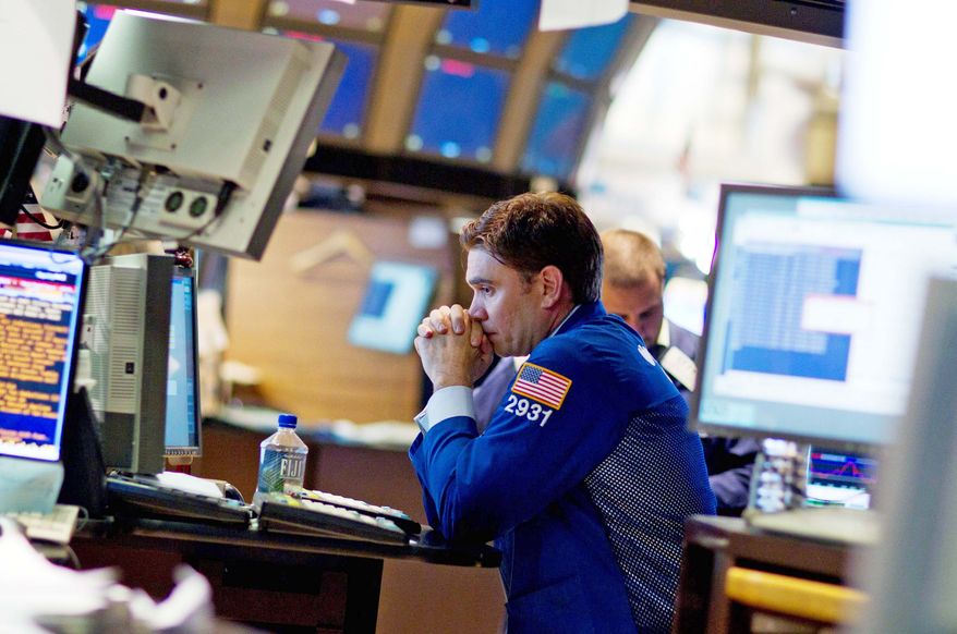 An electronic board displays trading activity on the floor of the New York Stock Exchange Thursday. The Dow plunged 513 points, 4.3 percent, its ninth-largest point drop ever. The S&P 500 fell 5 percent. (Associated Press)