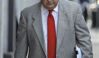 ** FILE ** Retired New Orleans police Sgt. Arthur &quot;Archie&quot; Kaufman, charged with covering up the deadly shootings of civilians on the Danziger Bridge in New Orleans in the aftermath of Hurricane Katrina, enters federal court on Monday, July 11, 2011, in New Orleans. (AP Photo/The Times-Picayune, Ted Jackson)