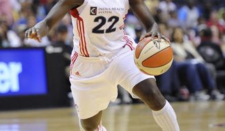 In her season debut, Matee Ajavon led all scorers with 19 points in the Mystics&#39; 64-61 win over the Shock. (AP Photo/Nick Wass)