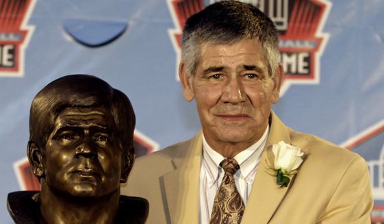 Hall of Fame inductee Chris Hanburger poses with his bust during the 2011 Pro Football Hall of Fame Induction Ceremony in Canton, Ohio on August 6, 2011.  (AP Photo/Tony Dejak) **FILE**
