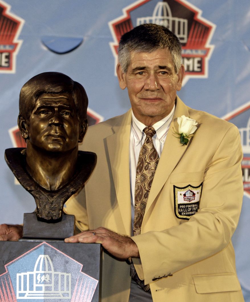 Hall of Fame inductee Chris Hanburger poses with his bust during the 2011 Pro Football Hall of Fame Induction Ceremony in Canton, Ohio on August 6, 2011.  (AP Photo/Tony Dejak) **FILE**