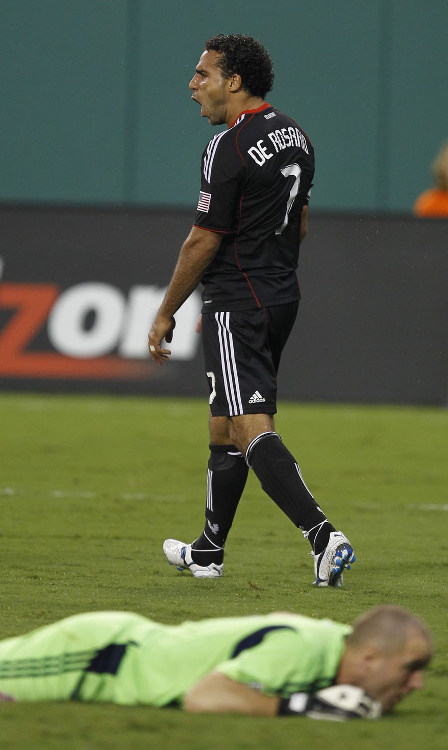 D.C. United's Dwayne De Rosario (7) celebrates after scoring his second goal of three goals against Toronto FC. The game ended in a 3-3 tie after Rosario scored a penalty kick in the 88th minute. (AP Photo/Luis M. Alvarez)