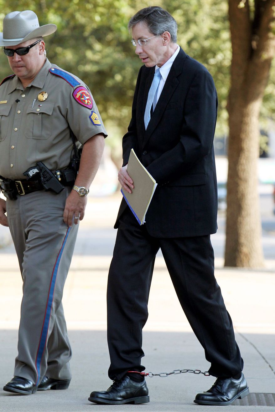ASSOCIATED PRESS
Convicted polygamist leader Warren Jeffs is escorted into the courthouse in San Angelo, Texas, on Tuesday for sentencing. He received life in prison and a consecutive 20-year term.