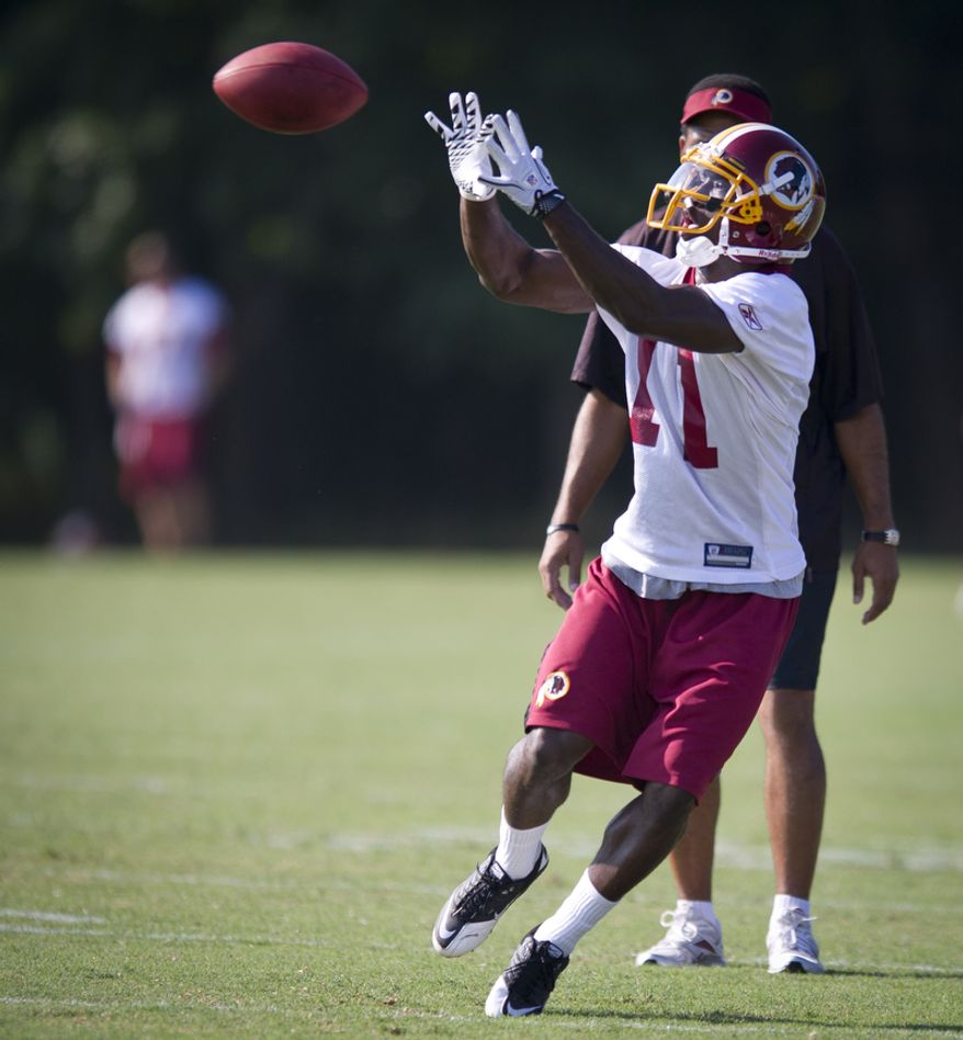 Wide receiver Aldrick Robinson pulls down a pass during drills. (Rod Lamkey Jr./The Washington Times)