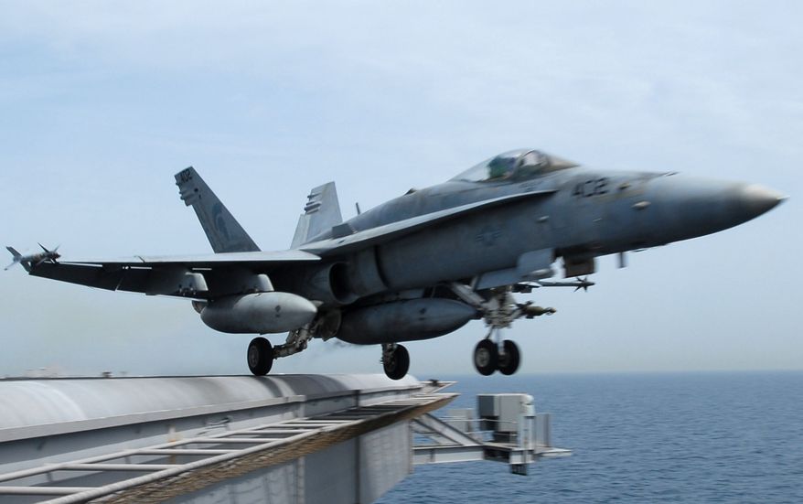 ** FILE ** An F/A-18C Hornet takes off from the Nimitz-class aircraft carrier USS John C. Stennis (CVN 74) in March 2007. (AP Photo/U.S. Navy, Paul J. Perkins, File)