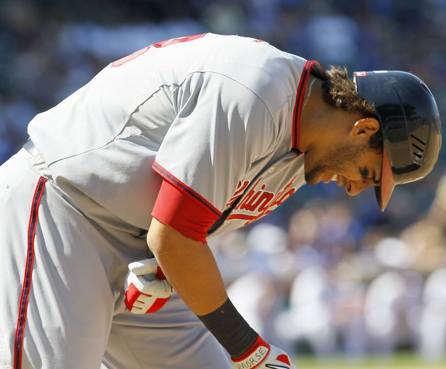 Washington Nationals' Michael Morse reacts after being hit by a pitch from Chicago Cubs starter Ryan Dempster during the seventh inning of a Thursday. Morse left the game and was taken for X-rays. (AP Photo/Charles Rex Arbogast)