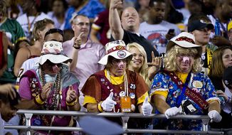Members of the Hogettes cheers on their Washington Redskins as they leave the field at half time at FedEx Field in Landover, Md, Friday, August 12, 2011. (Rod Lamkey Jr./The Washington Times)