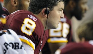 Washington Redskins quarterback Rex Grossman sits on the beach during the second half of an NFL preseason football game against the Pittsburgh Steelers in Landover, Md., on Friday, Aug. 12, 2011. (AP Photo/Nick Wass)