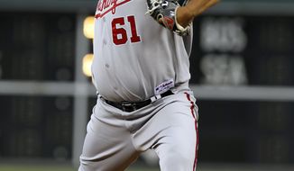 Washington Nationals starting pitcher Livan Hernandez threw 6 2/3 innings and allowed just one unearned run in the Nats&#39; 4-2 win over the Philadelphia Phillies on Friday. (AP Photo/Alex Brandon)