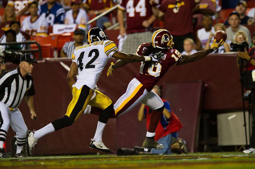 Redskins wide receiver Donte Stallworth (19) tries to haul in a pass while Steelers safety Da'Mon Cromartie-Smith (42) defends him, during the first half of a preseason game between the Washington Redskins and the Pittsburgh Steelers, at FedEx Field in Landover, Md., Friday, Aug. 12, 2011. (Drew Angerer/The Washington Times)