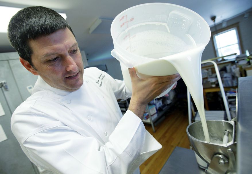"The bottom line is you want to stay in business," said Jim Capannari, an ice cream maker in Illionois, who raised the cost of his cones by 10 cents and then explained why to customers on a sign he posted. Mr. Capannari pours ingredients in making a batch of ice cream. (Associated Press)