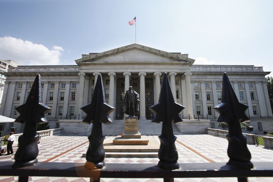 A statue of former Treasury Secretary Albert Gallatin stands guard outside the Treasury Building in Washington.