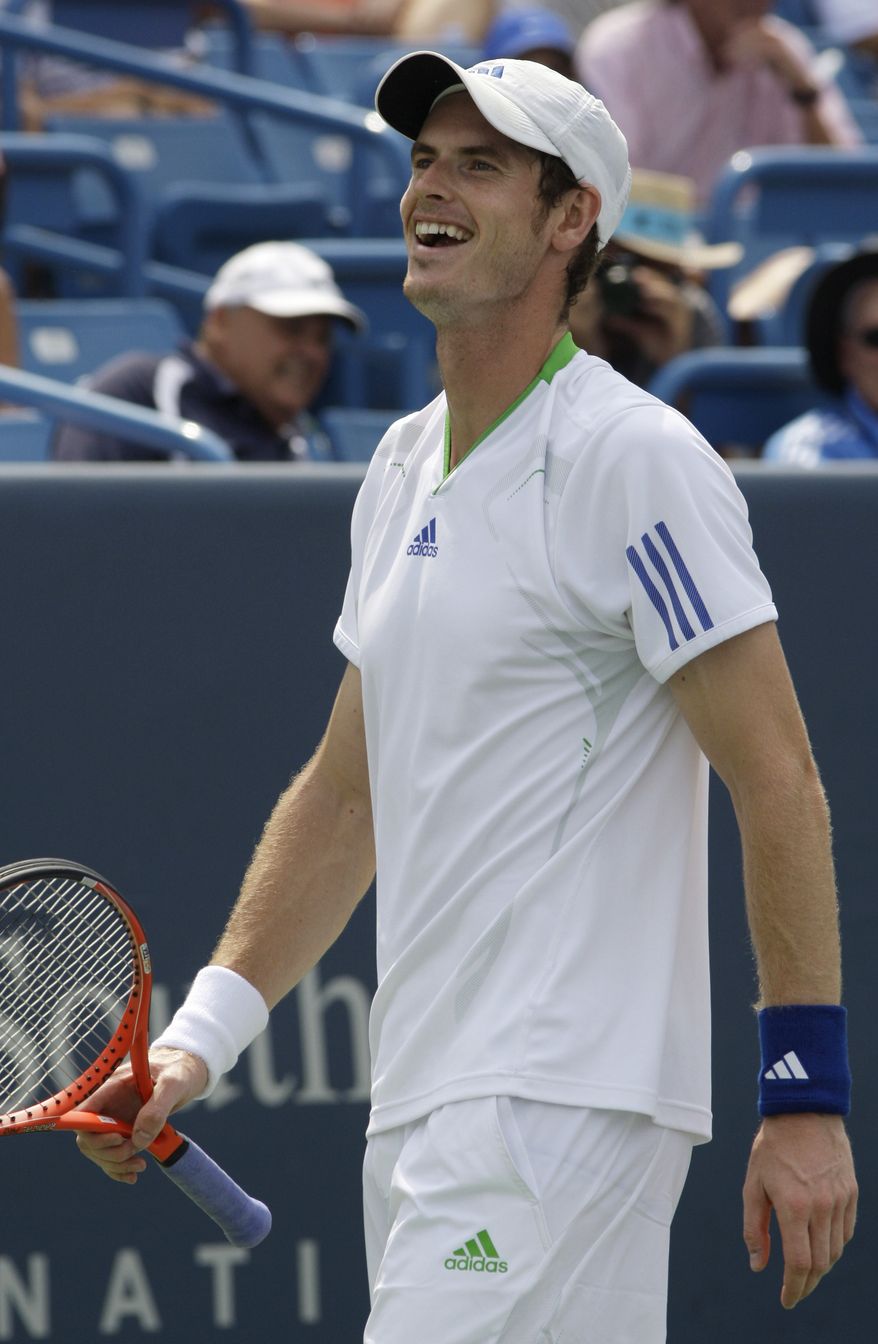 Andy Murray, from Great Britain, smiles after making a shot against Mardy Fish during a semifinal match at the Western & Southern Open tennis tournament, Saturday, Aug. 20, 2011 in Mason, Ohio. Murray won 6-3, 7-6 (8). (AP Photo/Al Behrman)