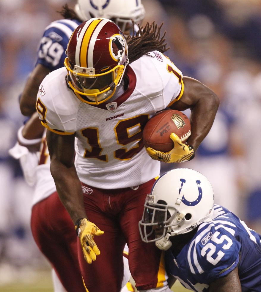 Washington Redskins wide receiver Donte Stallworth gets tackled after hauling in his only catch of the night, a 23-yarder from John Beck. (AP Photo/Michael Conroy)
