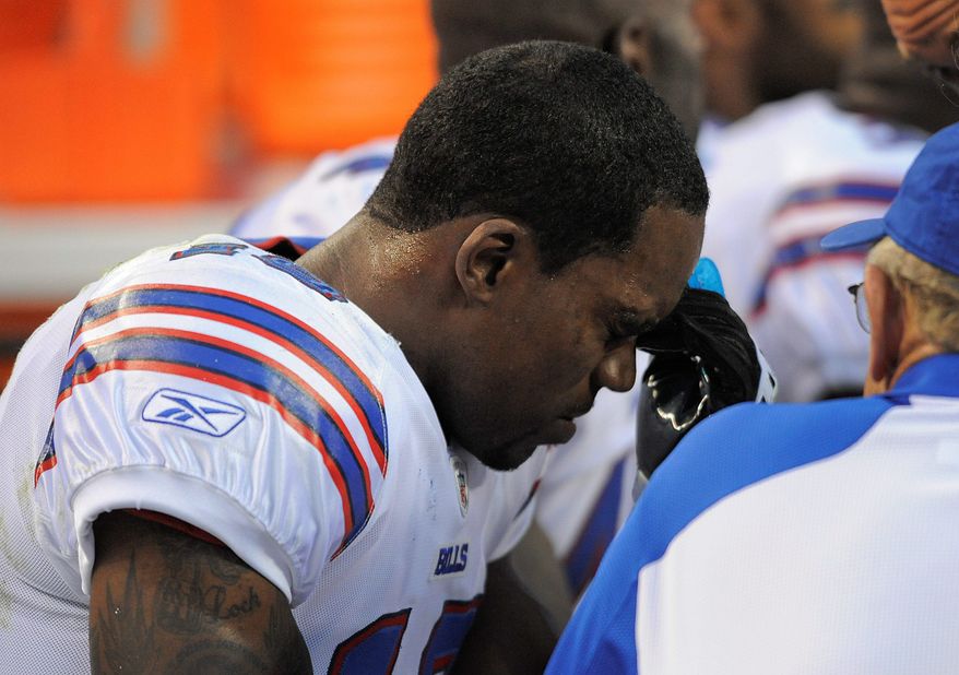 ASSOCIATED PRESS
Buffalo wide receiver Donald Jones reacts after absorbing a hard hit from Denver safety Rahim Moore during their preseason game Saturday.