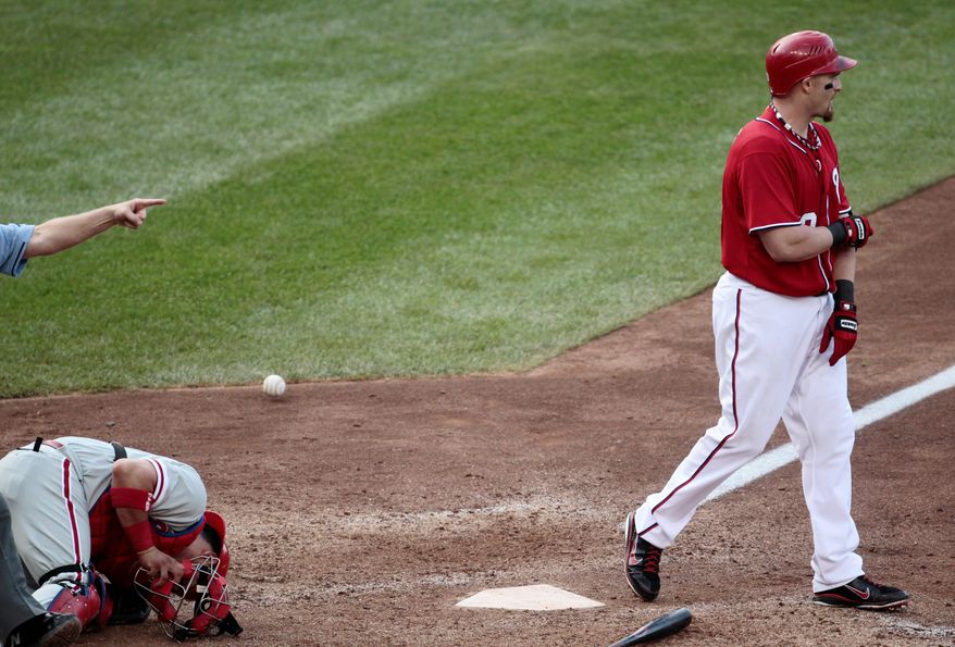 ASSOCIATED PRESS PHOTOGRAPHS
Nationals outfielder Jonny Gomes heads to first after being hit by a pitch to force in the winning run in the 10th inning. Washington took two of three from Philadelphia in the weekend series.