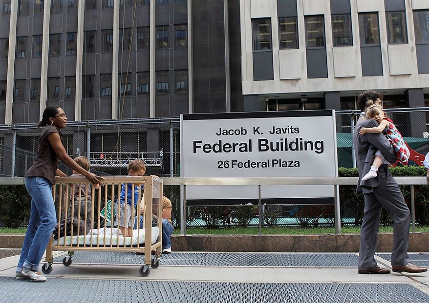 Children are evacuated from the Jacob K. Javits Federal building in New York on Tuesday, Aug. 23, 2011 after an earthquake centered northwest of Richmond, Va. was felt. (AP Photo/Mary Altaffer)