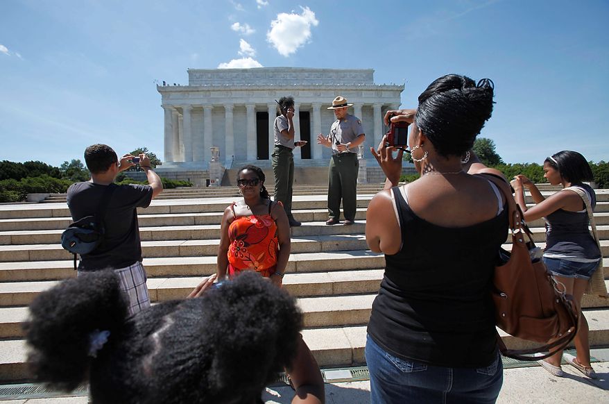 Tourists continue taking photographs at the Lincoln Memorial in Washngton, Tuesday, Aug. 23,2011, as security kept them from entering after the Memorial was evacuated following an earthquake in the Washington area. A 5.9 magnitude earthquake centered in Virginia forced evacuations of all the monuments on the National Mall in Washington and rattled nerves from Georgia to Martha's Vineyard, the Massachusetts island where President Barack Obama is vacationing. No injuries were immediately reported. (AP Photo/Jacquelyn Martin)