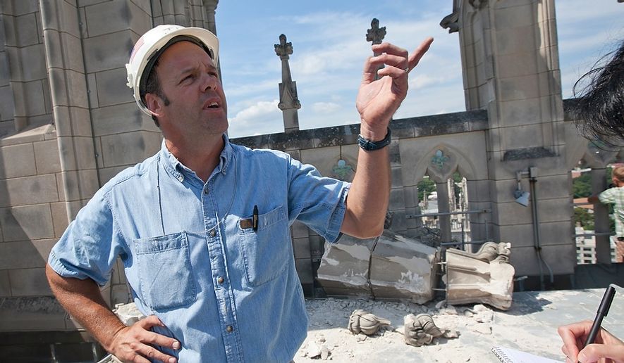 Mason foreman Joe Alonso explains Aug. 24, 2011, how much damage was done to the center tower at the National Cathedral during a 5.8-magnitude earthquake the day prior. (Andrew S. Geraci/The Washington Times)