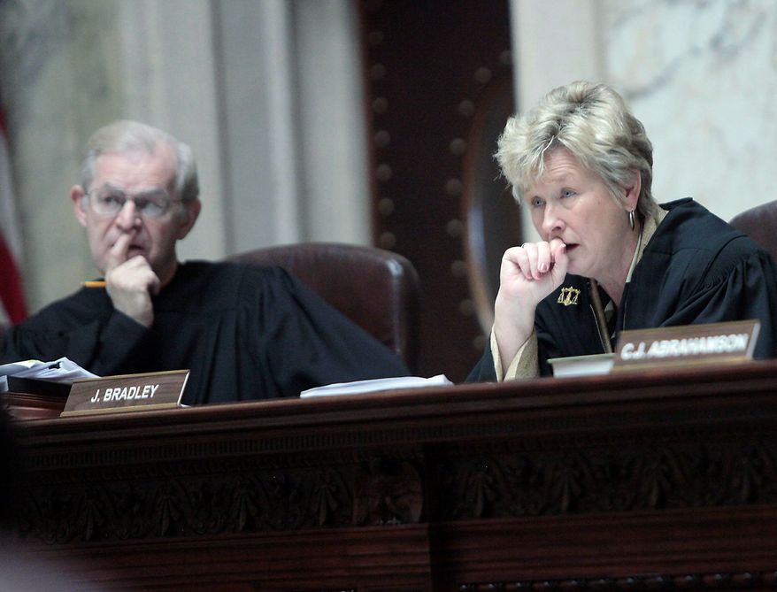ASSOCIATED PRESS
Justices David Prosser and Ann Walsh Bradley work side by side on the Wisconsin Supreme Court, but an altercation in June brought them close to the other side of the legal bench. Justice Walsh Bradley accused Justice Prosser of choking her during deliberations over the state&#39;s collective-bargaining law.