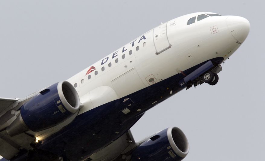 A Delta Air Lines jet takes off from Detroit Metropolitan Wayne County Airport, one of the airline's hubs, in Romulus, Mich., on Friday, July 22, 2011. (AP Photo/Carlos Osorio)