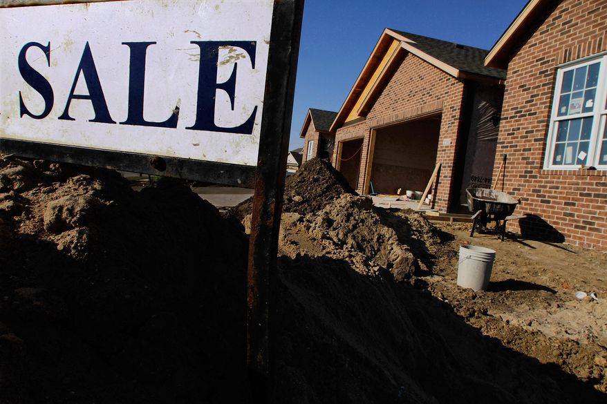 A new home under construction displays a sale sign on Monday, Aug. 22, 2011, in Springfield, Ill. (AP Photo/Seth Perlman)