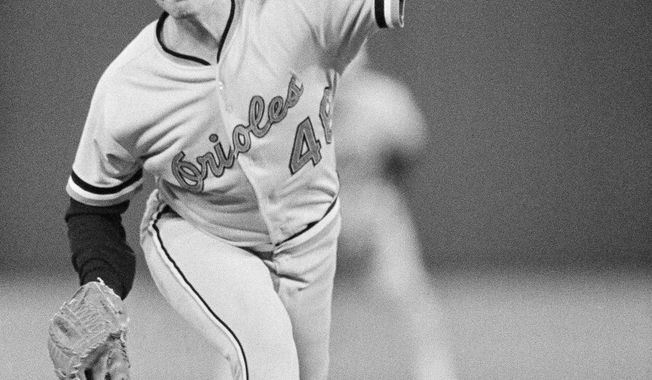 **FILE** Baltimore Orioles pitcher Mike Flanagan throws against the Philadelphia Phillies in the 1983 World Series in Philadelphia. Flanagan, a former Cy Young winner who won 167 games over 18 seasons with Baltimore and Toronto, was found dead outside his home on Aug. 24, 2011. (Associated Press)