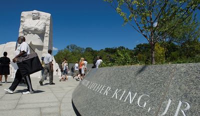 &quot;it&#39;s amazing to be here today,&quot; said Washington, D.C. native Michael Berry, seen here walking past the sculpture of Dr. Martin Luther King Jr., who was first in line to see the new Martin Luther King Jr. Memorial when it opened to the public on Monday, Aug. 22, 2011. Mr. Berry says he was 13 when Dr. King was assassinated, and he remembers the riots and the impact they had on his neighborhood, his city and the nation. He says he&#39;ll be coming down again on Sunday for the dedication. (Barbara L. Salisbury/The Washington Times)