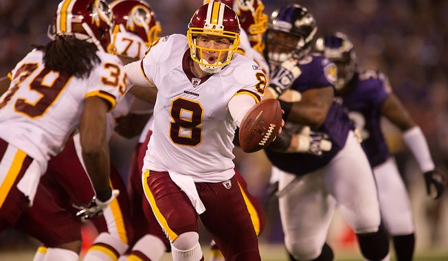 Quarterback Rex Grossman of the Washington Redskins hands off to Dante Barnes in preseason football at M&amp;T Bank Stadium in Baltimore, MD, Thursday, August 25, 2011. (Andrew Harnik / The Washington Times)