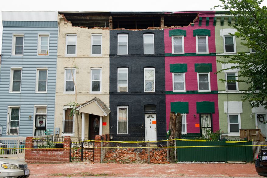 Hurricane Irene, which passed through the D.C. region on Saturday and early Sunday, damaged three row houses near Sixth and R streets NW in Washington. (Andrew Harnik/The Washington Times)