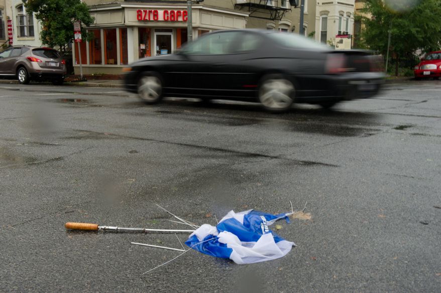 A destroyed umbrella lays in the street the morning after Hurricane Irene in Washington, DC, Sunday, August 28, 2011. (Andrew Harnik / The Washington Times)