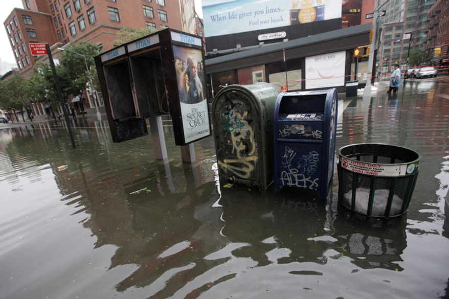Grand Street and West Broadway in the Soho neighborhood of Manhattan is flooded, Sunday, Aug. 28, 2011 in New York. (AP Photo/Mary Altaffer)