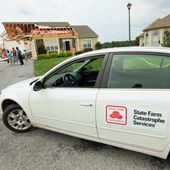 A State Farm Catastrophe Services vehicle is parked out front as people look over the damage to Sue and Jack Holloway&#x27;s home on Crab Apple Court in the Nassau Station development in Lewis, Del., on Sunday. A poll found that just 14 percent of homeowners had a flood insurance policy. The lowest coverage was in a region hit by Irene: The Northeast, with 5 percent. The highest coverage rate was in the South, with 19 percent. (Associated Press)