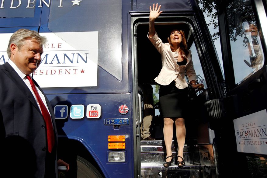 Rep. Michele Bachmann waves goodbye to a small group of supporters in the parking lot of Calistoga Bakery Cafe in Naples, Fla., on Monday after a brief campaign stop. (Naples (Fla.) Daily News via Associated Press)