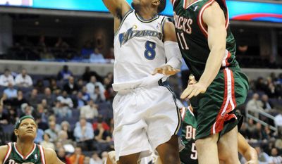 associated press
Javaris Crittenton (8) , shown against Milwaukee in a 2009 game, is wanted in connection with the shooting death of 22-year-old Jullian Jones.