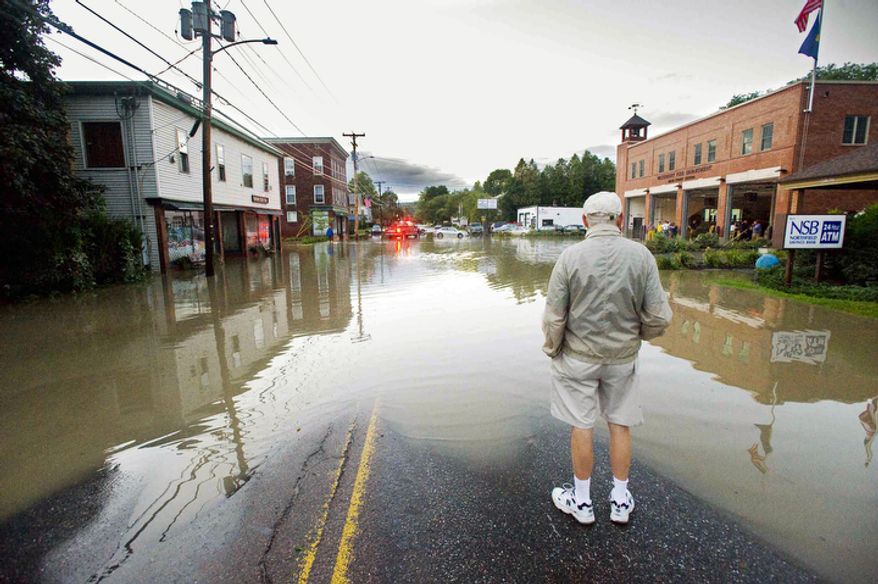 North Main Street in Waterbury, Vt., is underwater in the wake of tropical storm Irene. Almost 50,000 Vermont utility customers were without power Monday, hundreds of roads were closed and a number of bridges destroyed by the "epic" flooding caused by by the remnants of Hurricane Irene. (AP Photo/Burlington Free Press, Glenn Russell)