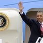 President Obama waves as he boards Air Force One at the Minneapolis St. Paul Airport in St. Paul, Minn., on Aug. 30, 2011, after addressing the American Legion in Minneapolis. (Associated Press)