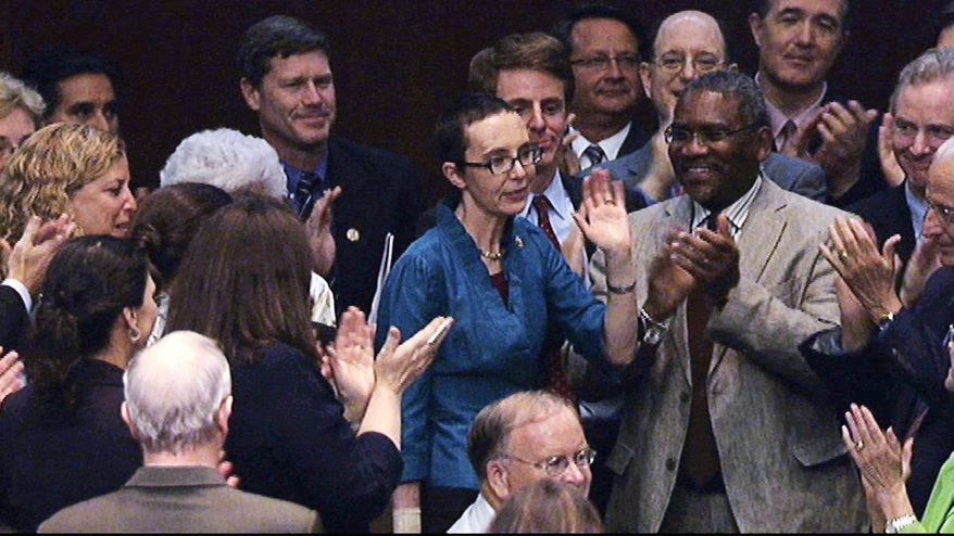 **FILE** Rep. Gabrielle Giffords, here taking a break from rehabilitation to participate in the House debt-ceiling vote on Aug. 1, has not said whether she will run for re-election in 2012. (Associated Press)